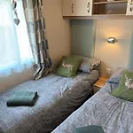 Woodpecker Lodge, Camelot Holiday Park, Ca6 5Sz